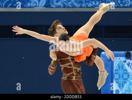 NO FILM, NO VIDEO, NO TV, NO DOCUMENTARY - Italy's Nicole Della Monica and Matteo Guarise perform their figure skating short program during the Winter Olympics at the Iceberg Skating Palace in Sochi, Russia, Tuesday, February 11, 2014. Photo by Chuck Myers/MCT/ABACAPRESS.COM Stock Photo