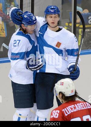NO FILM, NO VIDEO, NO TV, NO DOCUMENTARY - Finland defenseman Olli Maatta (3) celebrates with Finland forward Petri Kontiola (27), following his goal against Norway in the third period at Shayba Arena during Winter Olympics in Sochi, Russia, Friday, February 14, 2014. Finland defeated Norway, 6-1. Photo by Chuck Myers/MCT/ABACAPRESS.COM Stock Photo