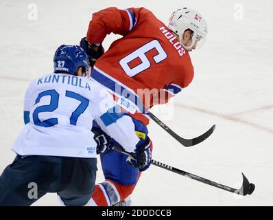 NO FILM, NO VIDEO, NO TV, NO DOCUMENTARY - Finland forward Petri Kontiola (27) reaches for the puck against Norway defenseman Jonas Holos (6) in the third period at Shayba Arena during Winter Olympics in Sochi, Russia, Friday, February 14, 2014. Finland defeated Norway, 6-1. Photo by Chuck Myers/MCT/ABACAPRESS.COM Stock Photo