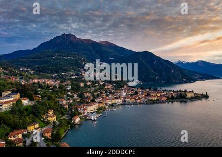 Italy, Province of Como, Menaggio, Helicopter view of town on shore of Lake Como at dawn Stock Photo