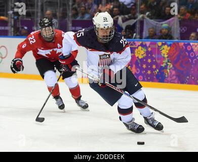 NO FILM, NO VIDEO, NO TV, NO DOCUMENTARY - USA forward Alex Carpenter (25) skates away from Canada forward Hayley Wickenheiser (22) during the second period of the women's Gold Medal hockey game at the Winter Olympics in Sochi, Russia, Thursday, February 20, 2014. Photo by Harry E. Walker/MCT/ABACAPRESS.COM Stock Photo