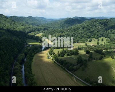 Drone view of Clinch River surrounded by forested hills in summer Stock Photo