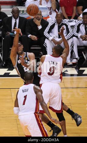 NO FILM, NO VIDEO, NO TV, NO DOCUMENTARY - San Antonio Spurs forward Tim Duncan is fouled by Miami Heat forward Rashard Lewis in the first quarter during Game 3 of the NBA Finals at AmericanAirlines Arena in Miami, FL, USA on June 10, 2014. Photo by David Santiago/El Nuevo Herald/MCT/ABACAPRESS.COM Stock Photo