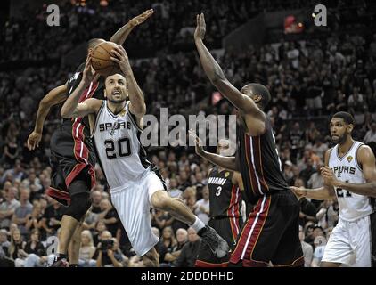 NO FILM, NO VIDEO, NO TV, NO DOCUMENTARY - San Antonio Spurs guard Manu Ginobili drives past Miami Heat's Rashard Lewis and Chris Bosh during the first half in Game 5 of the NBA Finals at the AT&T Center in San Antonio, TX, USA, on Sunday, June 15, 2014. Photo by Michael Laughlin/Sun Sentinel/MCT/ABACAPRESS.COM Stock Photo