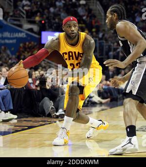 NO FILM, NO VIDEO, NO TV, NO DOCUMENTARY - The Cleveland Cavaliers' LeBron James, left, looks to pass as the San Antonio Spurs' Tiago Splitter defends in the second quarter at Quicken Loans Arena in Cleveland, OH, USA on Novemer 19, 2014. Photo by Mike Cardew/Akron Beacon Journal/TNS/ABACAPRESS.COM Stock Photo