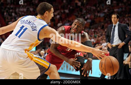 NO FILM, NO VIDEO, NO TV, NO DOCUMENTARY - The Miami Heat's James Ennis loses control of the ball in front of the Golden State Warriors' Klay Thompson 11 during the first half at AmericanAirlines Arena in Miami, FL, USA on November 25, 2014. Photo by Michael Laughlin/Sun Sentinel/TNS/ABACAPRESS.COM Stock Photo