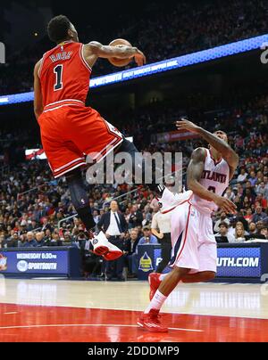 NO FILM, NO VIDEO, NO TV, NO DOCUMENTARY - Chicago Bulls guard Derrick Rose blocks a shot by Atlanta Hawks guard Jeff Teague at Philips Arena in Atlanta, GA, USA on December 15, 2014. Photo by Curtis Compton/Atlanta Journal-Constitution/TNS/ABACAPRESS.COM Stock Photo