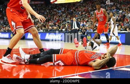 NO FILM, NO VIDEO, NO TV, NO DOCUMENTARY - Chicago Bulls guard Derrick Rose and Atlanta Hawks forward DeMarre Carroll lay on the floor after Carroll collided with Rose while trying to drive the lane at Philips Arena in Atlanta, GA, USA on December 15, 2014. Photo by Curtis Compton/Atlanta Journal-Constitution/TNS/ABACAPRESS.COM Stock Photo