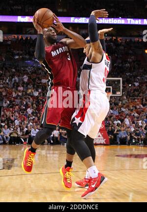 NO FILM, NO VIDEO, NO TV, NO DOCUMENTARY - The Miami Heat's Dwyane Wade, left, is fouled by the Washington Wizards' Drew Gooden during the second quarter at the AmericanAirlines Arena in Miami, FL, USA on December 19, 2014. Photo by David Santiago/El Nuevo Herald/TNS/ABACAPRESS.COM Stock Photo