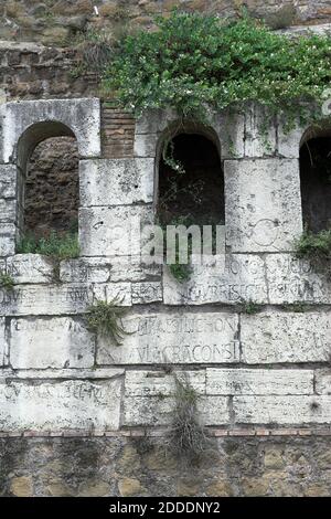 Roma Rom Italy, Italien; A fragment of the Aurelian Walls. A fragment of the Aurelian Walls. A stone and brick wall covered with inscriptions in Latin Stock Photo