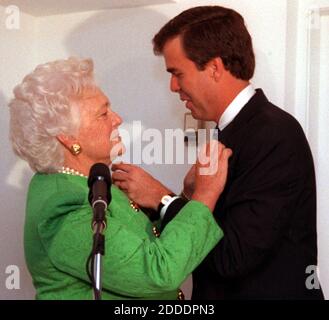 NO FILM, NO VIDEO, NO TV, NO DOCUMENTARY - File photo : Barbara Bush pins her pin on son Jeb and he pins her with his at a breakfast fundraiser that she was the featured speaker at to help son Jeb in his campaign on Sept. 28, 1994 at the private home of Sergio Pino in Coral Gables, Fla. Appearing before a raucous rally in front of thousands of supporters in Miami on Monday June 15, 2015, former Florida governor Jeb Bush officially launched his presidential election campaign. Photo by Maric Cohn Bandi/Miami Herald/TNS/ABACAPRESS.COM Stock Photo