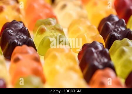 Colorful fruity gummy bears background, close up shot Stock Photo