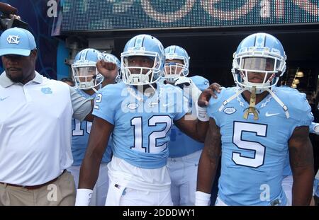 NO FILM, NO VIDEO, NO TV, NO DOCUMENTARY - North Carolina quarterback Marquise Williams (12) prepares to lead players out to warmup before a game against South Carolina in the Belk College Kickoff at Bank of America Stadium in Charlotte, N.C., on Thursday, Sept. 3, 2015. UNC wide receiver Juval Mollette (5) is at right. (Ethan Hyman/Raleigh News & Observer/TNS/ABACAPRESS.COM Stock Photo