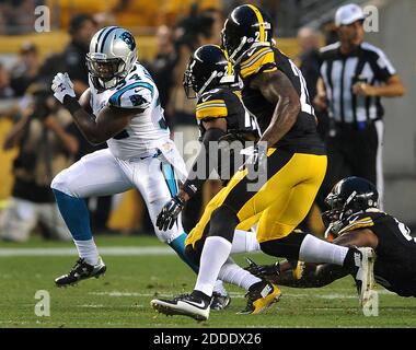 Carolina Panthers running back Cameron Artis-Payne (34) crosses the goal  line against New Orleans Saints cornerback Marshon Lattimore (23) on a  tcoudhown carry in the first half of an NFL football game