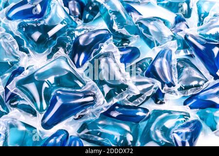 Blue washing capsules on white background, close up, abstract color background Stock Photo