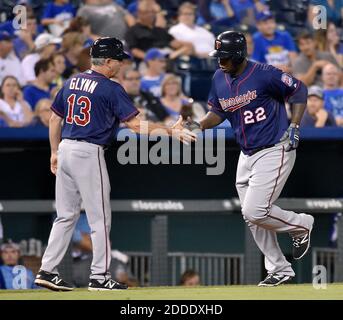 NO FILM, NO VIDEO, NO TV, NO DOCUMENTARY - The Minnesota Twins' Miguel Sano (22) is congratulated by third base coach Gene Glynn after hitting a solo home run in the 12th inning against the Kansas City Royals on Wednesday, Sept. 9, 2015, at Kauffman Stadium in Kansas City, Mo. (John Sleezer/Kansas City Star/TNS) Stock Photo