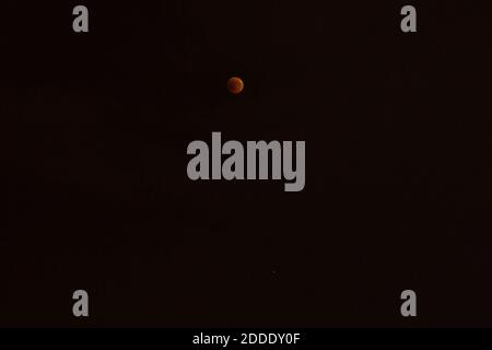 The full Moon turns red during total lunar eclipse with planet Mars under the Moon in Krasnodar, Russia on July 27, 2018. Photo by Nasser Berzane/ABACAPRESS.COM. Stock Photo