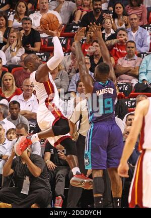 NO FILM, NO VIDEO, NO TV, NO DOCUMENTARY - The Miami Heat's Dwyane Wade, left, shoots in the first quarter against the Charlotte Hornets on Wednesday, October 28, 2015, at AmericanAirlines Arena in Miami, FL, USA. The Heat won, 104-94. Photo by Hector Gabino/El Nuevo Herald/TNS/ABACAPRESS.COM Stock Photo
