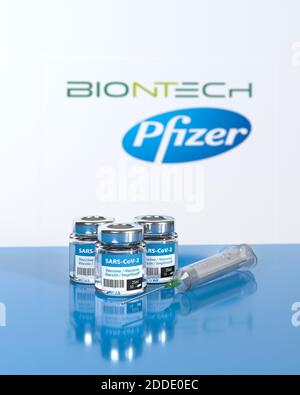 Vaccination against Corona Virus SARS-CoV-2 by Biontech / Pfizer: Three bottles 10 doses each. The word vaccination in English, Spanish, French and Ge Stock Photo
