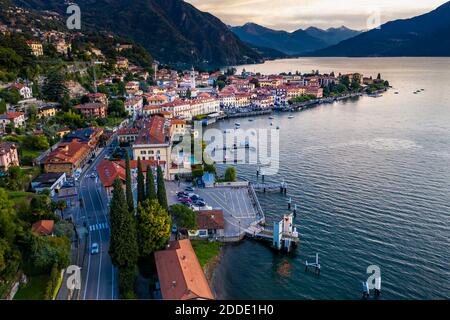 Italy, Province of Como, Menaggio, Helicopter view of town on shore of Lake Como at dawn Stock Photo