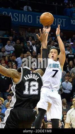 NO FILM, NO VIDEO, NO TV, NO DOCUMENTARY - Charlotte Hornets guard Jeremy Lin shoots the ball over San Antonio Spurs forward LaMarcus Aldridge during Monday night's game at Time Warner Cable Arena in Charlotte, NC, USA on March 21, 2016. The Charlotte Hornets defeated the San Antonio Spurs 91-88. Photo by Robert Lahser/Charlotte Observer/TNS/ABACAPRESS.COM Stock Photo