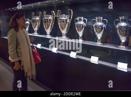 Woman looks at silverware won by Real Madrid Football Club in the Santiago Bernabéu Stadium, Madrid, Spain Stock Photo