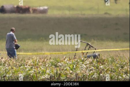 NO FILM, NO VIDEO, NO TV, NO DOCUMENTARY - The partial frame of a hot air balloon is visible above a crop field in Maxwell, Texas, as investigators comb the wreckage of an accident that killed 16 people near Lockhart, TX, USA, on Saturday, July 30, 2016. Photo by Ralph Barrera/Austin American-Statesman/TNS/ABACAPRESS.COM Stock Photo