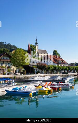 Austria, Upper Austria, Attersee am Attersee, Pedal boats moored in marina of lakeshore village in summer Stock Photo