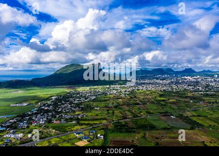 Mauritius, Black River, Flic-en-Flac, Helicopter view of island city with Corps de Garde mountain in background Stock Photo