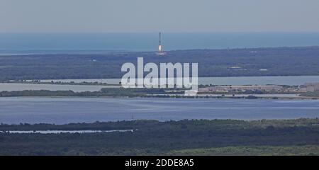 NO FILM, NO VIDEO, NO TV, NO DOCUMENTARY - The first stage of a SpaceX Falcon 9 rocket returns to Cape Canaveral, FL, USA, on Monday, August 14, 2017 after lifting off from launch pad 39A a few minutes earlier from the Kennedy Space Center carrying a Dragon spacecraft that will deliver cargo to the International Space Station. Photo by Red Huber/Orlando Sentinel/TNS/ABACAPRESS.COM Stock Photo