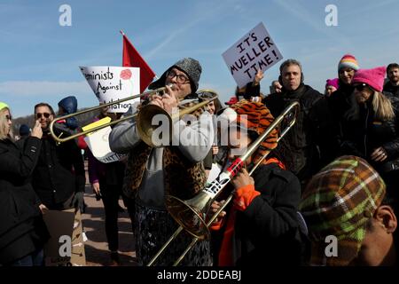 NO FILM, NO VIDEO, NO TV, NO DOCUMENTARY - A brass band plays in the crowd of protesters at the Women's March Chicago, IL, USA, on Saturday, January 20, 2018. Photo by Nancy Stone/Chicago Tribune/TNS/ABACAPRESS.COM Stock Photo