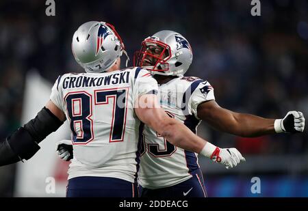 New England Patriots tight ends Dwayne Allen, left, and Rob Gronkowski  watch from the sideline during the first half of a preseason NFL football  game against the Philadelphia Eagles, Thursday, Aug. 16