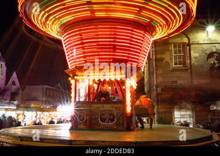 Petworth Fair has been in existance for 800 years by Royal Charter. The Harris family operate the traditional gallopers and chairoplanes. Stock Photo