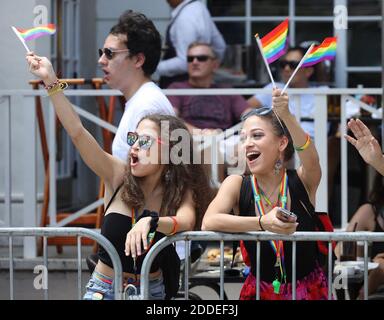NO FILM, NO VIDEO, NO TV, NO DOCUMENTARY - Giselle and Cindy Sanchez, 19, cheer on and wave flags on the parade route during Miami Beach's 11th annual LGBT 'Pride' Parade on Sunday, April 7, 2019 in Miami, FL, USA. Photo by Carl Juste/Miami Herald/TNS/ABACAPRESS.COM