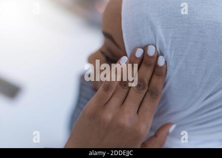 African muslim  businesswoman feeling unwell suffering from headache migraine touching forehead during work, upset black woman employee frustrated by Stock Photo