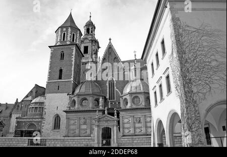 The Wawel Royal Castle Complex in the old town of Krakow, Poland, is a symbol of Polish statehood and its cultural heritage.  Built in the 13th and 14th centuries, the castle grounds includes the Polish Crown Treasury, the Royal Chapel, the Wawel Cathedral, Sigismund Chapel, and the royal residence.  The castle architecture is a mix of Romanesque, Gothic, Renaissance, and Early Baroque contributing to its UNESCO World Heritage Site designation in 1978. Stock Photo