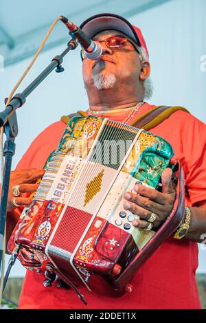 Florida Ft. Fort Lauderdale Cajun Zydeco Crawfish Festival,celebration fair event musician performing singer singing plays playing accordian,microphon Stock Photo