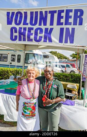 Florida Ft. Fort Lauderdale Cajun Zydeco Crawfish Festival,celebration fair event volunteer check in women Black volunteers, Stock Photo