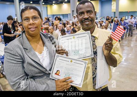 Florida,Miami Beach Convention Center,centre,naturalization ceremony oath of citizenship Pledge Allegiance,immigrants Black woman female man new citiz Stock Photo