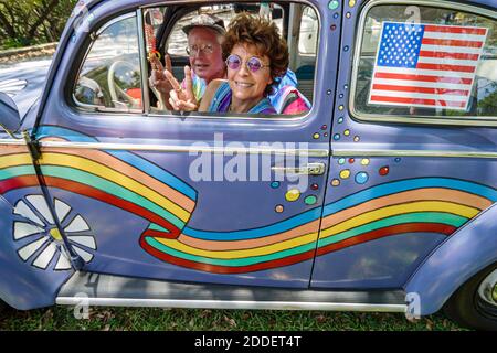 North Miami Beach Florida,Miami Dade Parks,Greynolds Park Love In event celebrate 1960s culture,couple man woman female hippie VW Bug Volkswagen Beetl Stock Photo