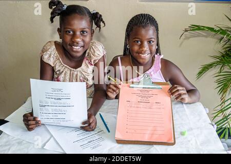 Miami Florida,Little Haiti Edison Park Elementary School Career Day,student students Black girls friends sign in up,Parent Involvement Center, Stock Photo