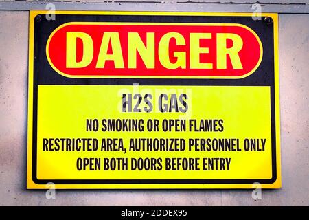 Closeup of a yellow Danger H2S Gas sign Stock Photo