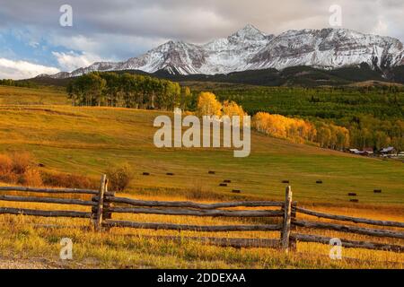 Ranch beneath snow capped Wilson Peak in autumn, Wilson Mesa, San Juan Mountains, San Miguel County, Colorado