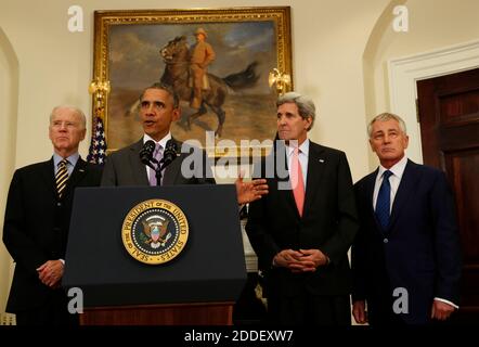 United States President Barack Obama (C) delivers a statement on the legislation he sent to Congress to authorize the use of military force (AUMF) against ISIL, while US Vice President Joe Biden (L) and Secretary of States John Kerry (2R) and Secretary of Defense Chuck Hagel (R) listen, in the Roosevelt Room of the White House, in Washington, DC on February 11, 2015. Credit: Aude Guerrucci / Pool via CNP /MediaPunch