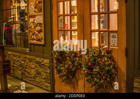 Augusta, Ga USA - 11 22 20: Cracker Barrel Restaurant holiday wreaths on the front doors Stock Photo