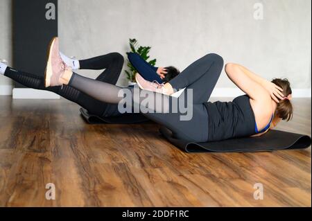 women engaged in strength and functional training in the studio Stock Photo