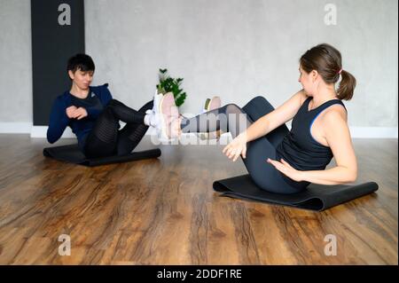 women engaged in strength and functional training in the studio Stock Photo