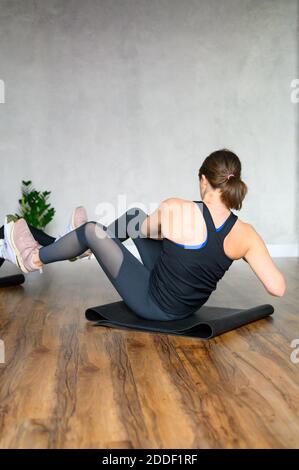 women engaged in strength and functional training in the studio. vertical photo Stock Photo