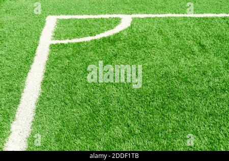 white corner field line on artificial green grass of soccer field Stock Photo
