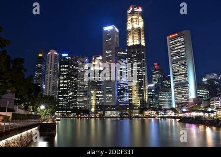 SINGAPORE - 2nd April 2019 - SIngapore skyline at night at Boat Quay on the Singapore River. Stock Photo